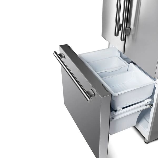  Front view of the FORNO 30-inch French door refrigerator from the 2-Piece Appliance Package with the lower freezer drawer open, revealing a spacious interior with deep storage bins—designed for easy access to frozen foods and organized freezer storage.