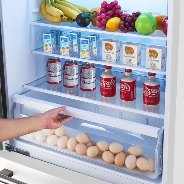 Interior view of the Forno 31-inch left-hinge refrigerator in white, showcasing adjustable glass shelves and clear storage drawers designed for efficient organization of fresh produce and groceries.