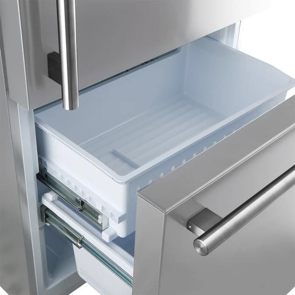 Open view of the freezer drawer in the FORNO 31-inch right-hinge refrigerator in stainless steel, showcasing the spacious lower compartment with organized storage bins for frozen items.