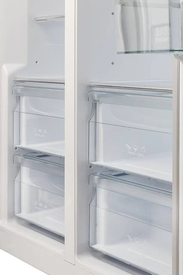 Close-up view of the drawers inside the FORNO 33-inch side-by-side refrigerator in stainless steel, highlighting the clear, spacious design for storing produce and perishables.