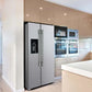 Lifestyle view of the FORNO 36-inch refrigerator with water dispenser in stainless steel, integrated into a modern kitchen setting with surrounding cabinetry and decor.