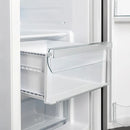 Close-up view of the crisper drawer inside the Forno 36-inch side-by-side refrigerator in white, featuring a clear, spacious design ideal for preserving fruits and vegetables at optimal freshness.
