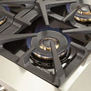 Close-up view of a single sealed burner on the FORNO 48-inch gas range from the 2-Piece Appliance Package, showing the durable cast iron grate, precision flame ring, and stainless steel cooktop surface—engineered for high heat output and responsive cooking control.