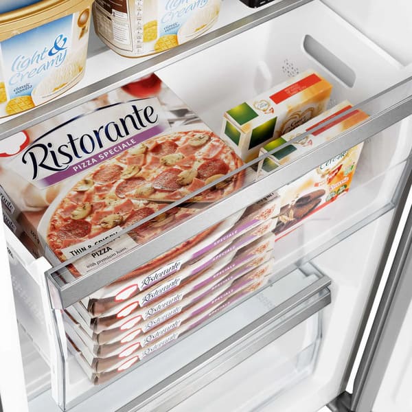 Close-up view of a clear interior drawer inside the FORNO pro-style refrigerator from the 3-Piece Appliance Package, designed with smooth gliding rails and ample space for storing produce, deli items, or beverages with easy access and visibility.