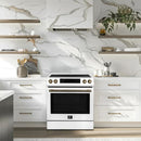 Lifestyle image of the FORNO 30-Inch Induction Range in white, shown in a modern kitchen setting with cabinetry and countertops for context.