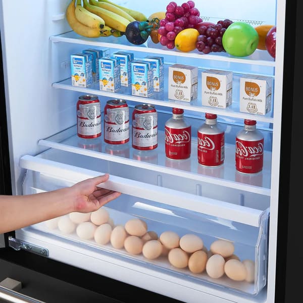Interior view of the FORNO 31-Inch Bottom Freezer Door Refrigerator in Black, highlighting the adjustable glass shelves and clear crisper drawers designed for optimal food organization and freshness.