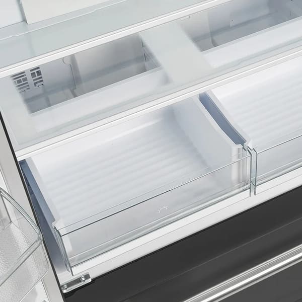 Interior view of the crisper drawers in the FORNO 36-Inch French Door Refrigerator in Black, showcasing spacious, transparent compartments ideal for keeping fruits and vegetables fresh.