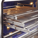 Interior view of FORNO Capriasca 36-Inch Gas Range featuring blue enamel cavity, convection fan, and three stainless steel telescopic oven racks.