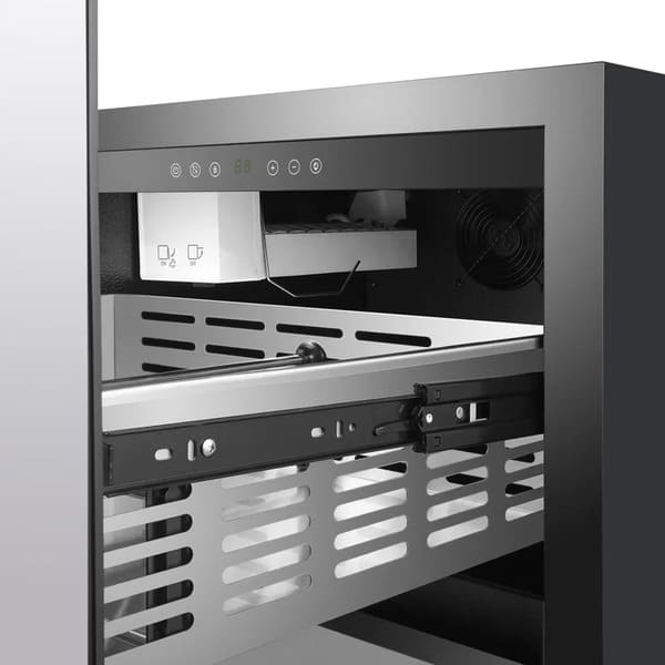 Close-up view of the built-in ice maker inside the FORNO Cosenza Drawer Freezer, showing the ice bin and efficient compact design integrated within the stainless steel interior.