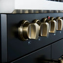 Close-up of the control panel on the FORNO Galiano 30-Inch French Door Dual Fuel Range in black, featuring zinc-coated metal knobs with bezel rings and LED backlighting for a premium look and precise control.