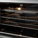 Close-up view of the air fryer basket inside the FORNO Giovanni 30-Inch Gas Range in black, highlighting its stainless steel build and blue enamel oven interior for healthier, crispy cooking.