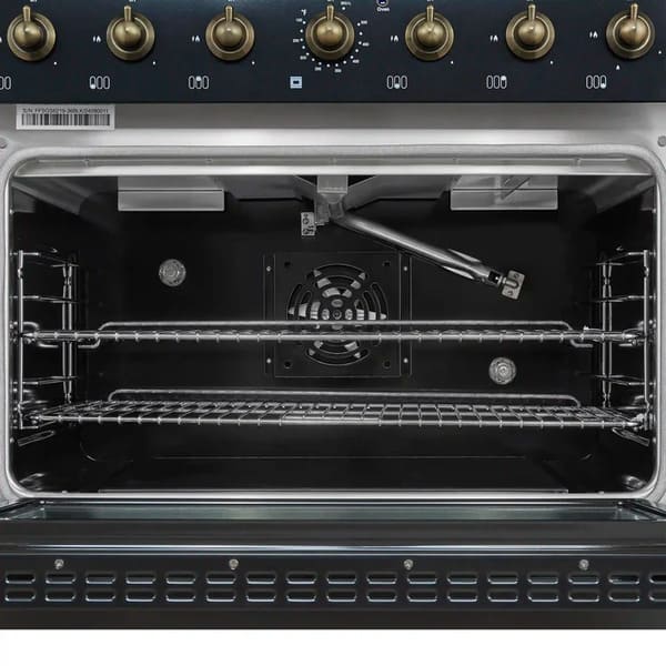 Interior view of the Forno Antico 36-Inch Dual Fuel Range oven, featuring a spacious blue enamel cavity, convection fan, and durable oven racks designed for multi-level cooking.