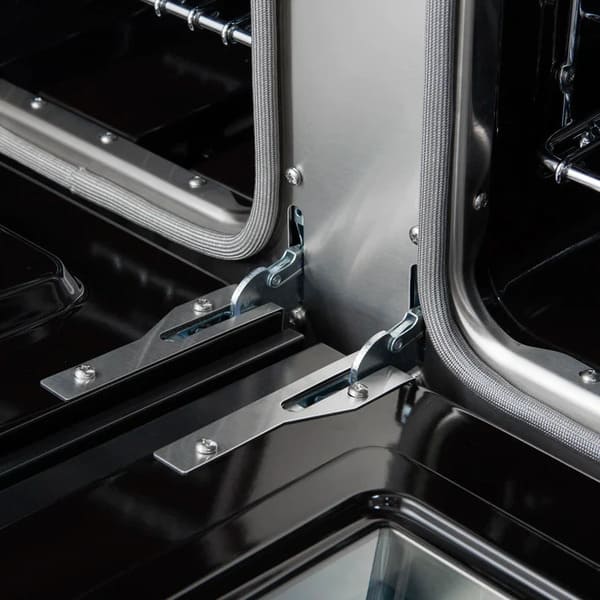 Close-up view of the oven door hinges on the Forno Antico 48-Inch Gas Range, showing robust construction designed for smooth, stable door operation and long-term durability.