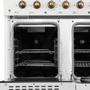 Interior view of the secondary oven in the Forno Antico 48-Inch Gas Range in white, showcasing a blue enamel finish, convection fan, and adjustable oven rack for smaller-scale cooking.